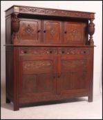 A Victorian Maple & Co carved oak court cupboard sideboard.