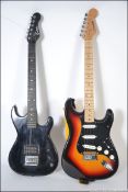 A Westfield stratocaster style six string electric guitar and carry case along with an Encore six