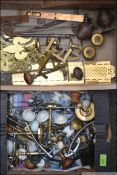 A large box of brass hinges, caubels, handles and latches,