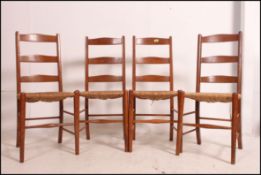 A set of 4 20th century rail back dining chairs raised on turned legs united by stretchers together