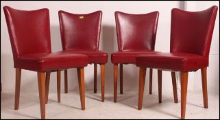 4 1960's Ben Chair type dining chairs having show wood angular frames upholstered in the original
