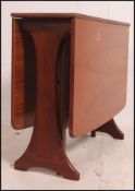 A retro 20th century G-Plan teak drop leaf dining table having splayed foot frame,