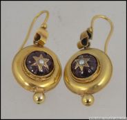 A pair of 9ct gold, ruby garnet stone and seed pearl ladies earrings complete with hoops,