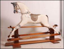 A large rocking horse by Haddon Rocking Horses Ltd,