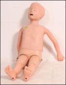 A 20th century first aid resuscitation doll being well articulated and ideal as shop display -