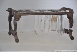 A vintage cast iron test tube vial stand to include 8 glass tubes. Measures: 20cms long.