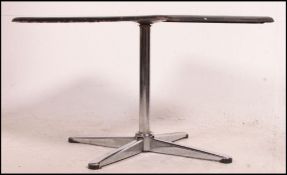 A retro enamel topped occasional / coffee table having a white tiled effect top raised on a
