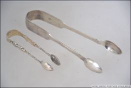 A pair of 19th century silver hallmarked sugar tongs by Elizabeth Eaton, London 1847, weight 32.7g.