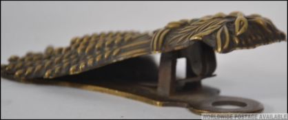 A Victorian brass letter clip by Whitehouse & Sons Rd Oct 15th 1845 No 556
