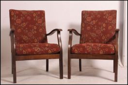 A pair of CC41 utility marked Mid century fireside armchairs of beech construction having original