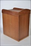 A mid 20th century Tambour fronted Stationery Desk Tidy originally from the Wills factory,