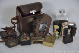 A collection of items to include papier mache snuff, wooden anvil snuff box, metal snuff box,