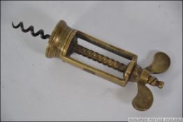 A Victorian brass corkscrew of Farrow & Jackson type with wire helix