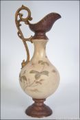 A 19th century Moore & Co Folyian ware Ivory Blush vase jug with scrolled handle and marks to the