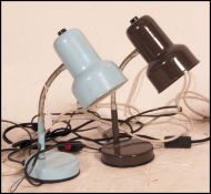 A collection of four retro 20th century desk lights to include a pair of different coloured