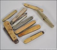 A collection of vintage pen knives to include mother of pearl handles,