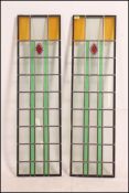 A pair of double glazed vacuum sealed units of stained glass with an Art Deco design originally