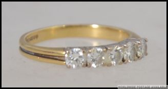 An 18ct gold hallmarked 5 stone channel set diamond ring.