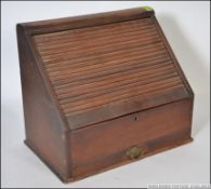 A mid 20th century Tambour fronted Stationery Desk Tidy originally from the Wills factory,