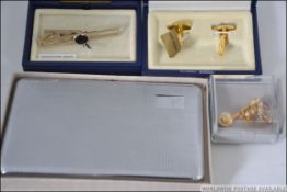 A collection of gentlemans items to include cuff links, watches, tie clips / pins,