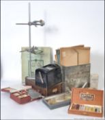 A group of laboratory / medical equipment to include large test tube clamp stand,