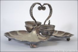 A late 19th century silver plated strawberry dish with cream and sugar by Walker & Hall on shell