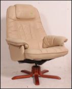 A good ivory leather swivel reclining armchair by Mobelteam - Sweden being fully badged.