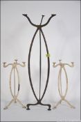 A collection of 3 unusual copper Art Nouveau stands of shaped form to include 2 small painted