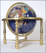 A large floor standing / table top semi-precious stone inlaid terrestrial globe of the world,
