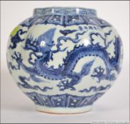 A large blue and white Chinese Kang-xi ribbed bowl vase with scenes of birds and trees etc.