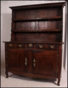 An 18th / 19th century French Chestnut dresser of large proportions being raised on squared legs