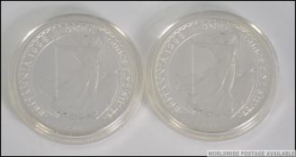 2 silver £2 proof coins in the cases, both one ounce fine silver,