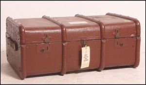 A good early 20th century canvas and cane bound steamer trunk having brass latches