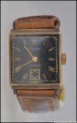 A 9ct gold gentlemans wristwatch by Weir & Sons of Dublin having 17 jewel swiss movement,