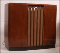 A 1950's Ferguson walnut stereogram having hinged top enclosing Garrard deck model no RC80.