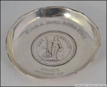 A sterling silver pin dish with inset 1902 silver one dollar trade coin.