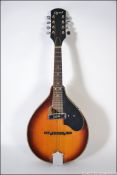 An Ozark Professional solid top Ozark 2254 'A' Model Mandolin - Oval Sound Hole Schaller pick up,