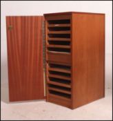 A retro industrial office teak wood finish filing cabinet having a single full length door opening