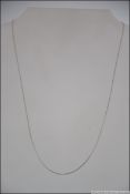 A 9ct white gold Italian fine chain linked necklace measuring 59cms long with bale and clasp. 0.