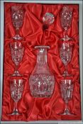 A cased 1970's Royal Tudor cut crystal glass decanter and goblets set.