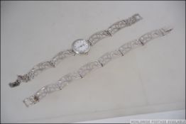A Sterling Silver ladies Rotary wristwatch with silver bracelet of abstract form together with a