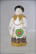 A Royal Worcester Connoisseur Collection candle snuffer in the form a Chinese Man entitled Mandarin.