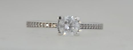 A 9ct white gold single stone ring.