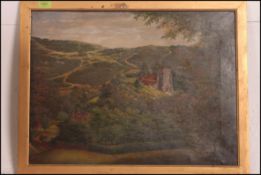 An early 20th century English school oil on canvas painting of a country scene with church scene