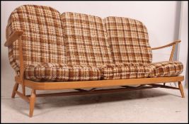 A Ercol Windsor pattern 1970's 3 seat sofa settee in beech and elm.