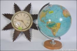 A retro 20th century desk top globe on swivel and plinth together with a mid century Metamec
