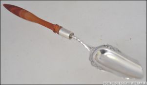 A 19th century silver marrow spoon having shaped elongated bowl with glass handle.