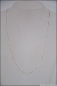 A 9ct gold bar linked necklace measuring 52cms long. 0.