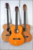 A group of three acoustic Spanish style six string guitars to include Elevation,