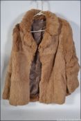 A good example of a light chestnut rabbit? fur short jacket ,